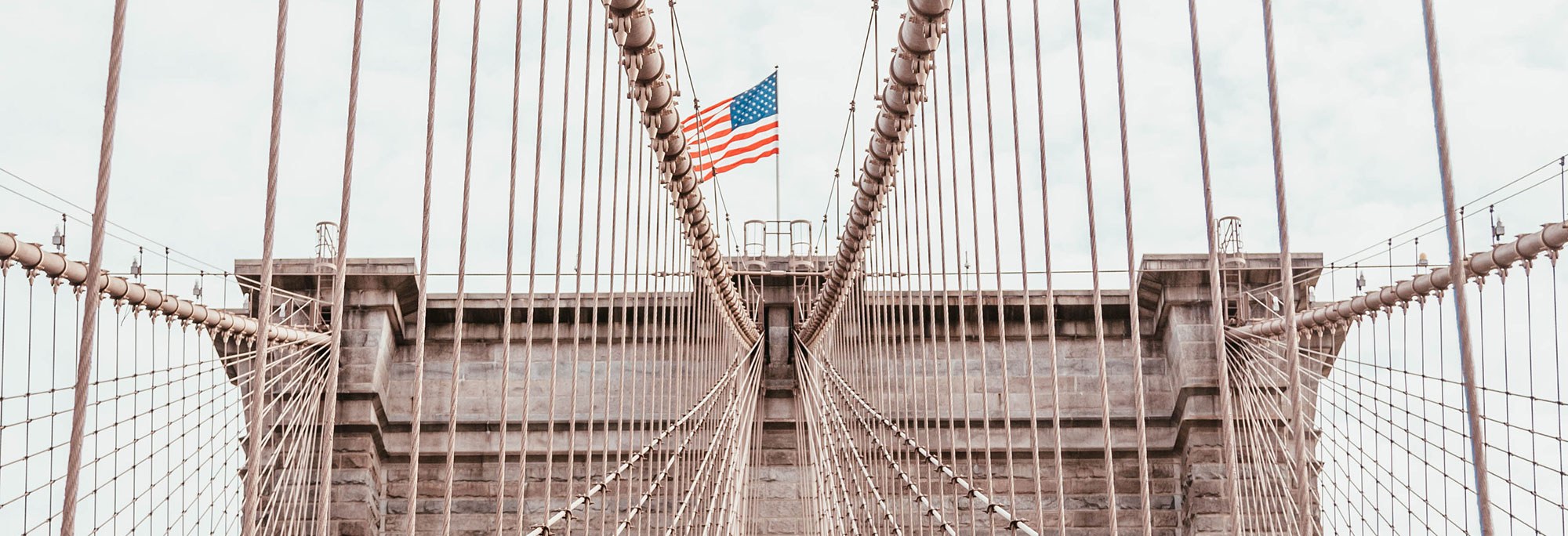 image of top of bridge with american flag at apex