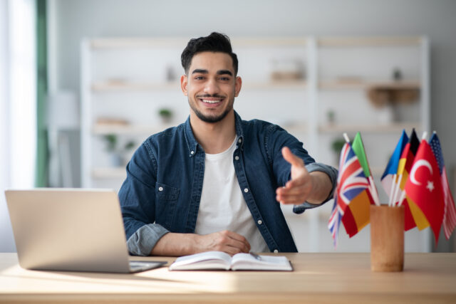 Cheerful guy foreign with flags