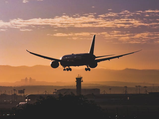 plane landing at sunset